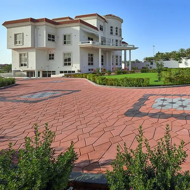 Winding garden pathway made from Red interlocking pasco pavers in Al Ain.